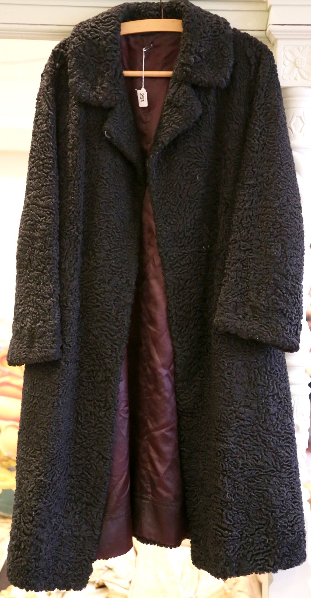A vintage, black astrakhan fur coat.