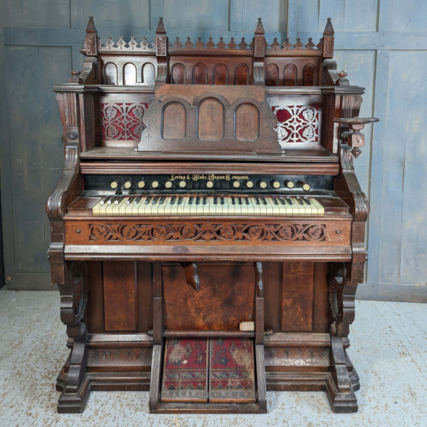 A large harmonium in a gothic style.