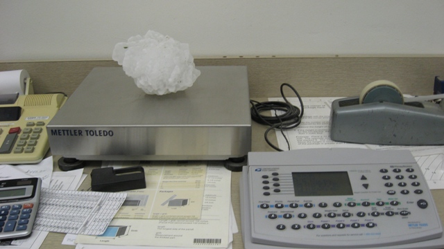 The record-setting piece of hail sits on a scale in a weather lab.